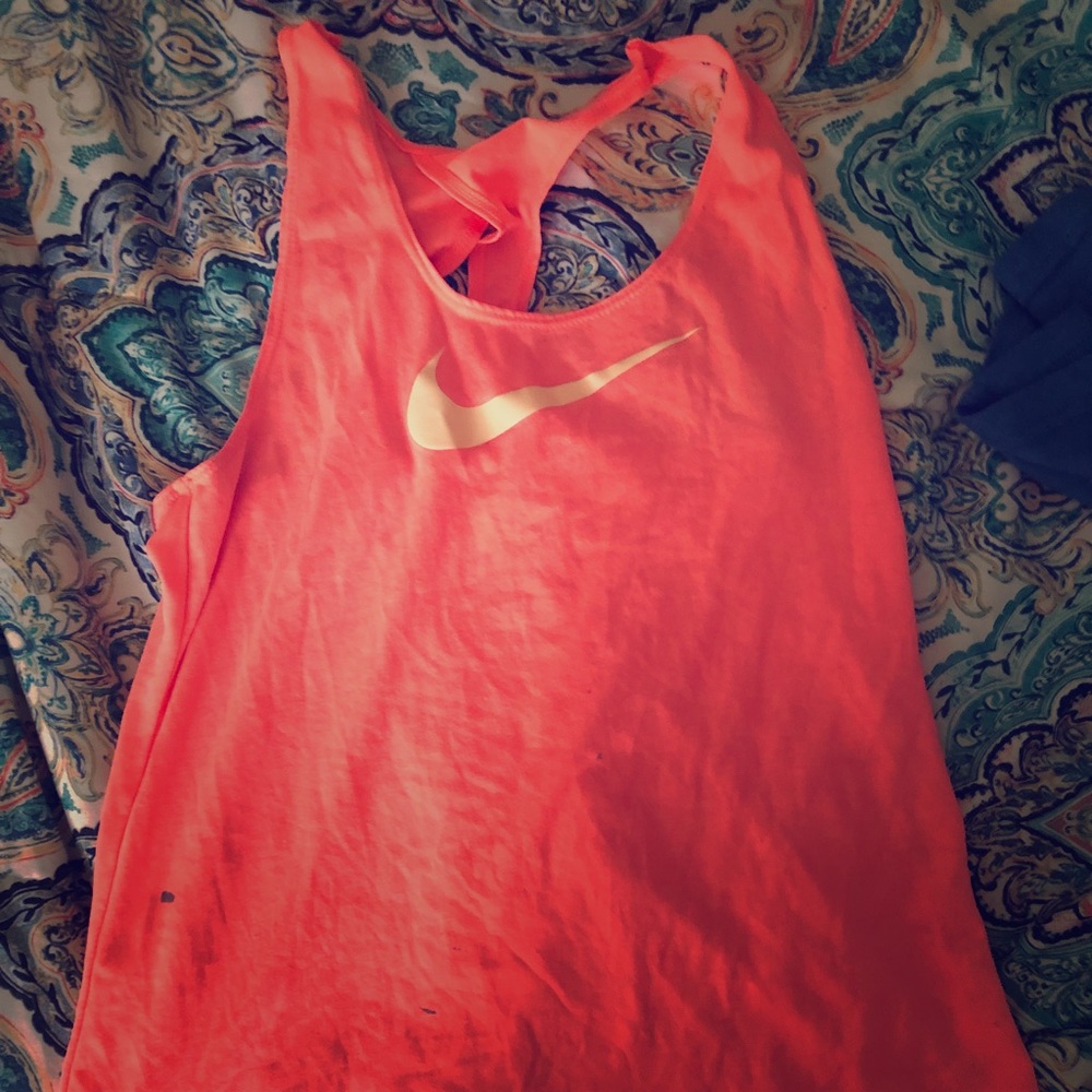 A coral Nike tank top